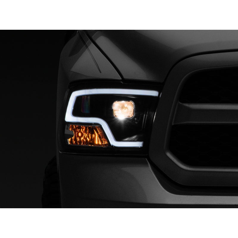 Raxiom 09-18 RAM 1500 LED Halo Projector Headlights- Black Housing (Clear Lens)